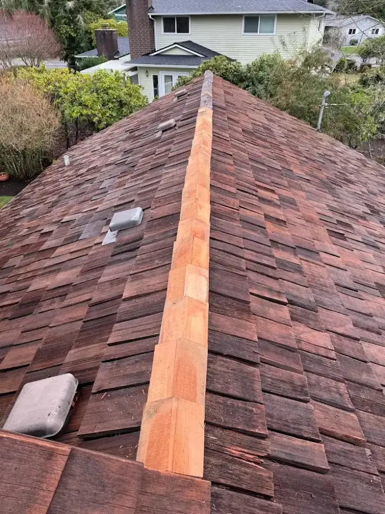 Cedar shake roof during restoration by First Choice Roof Service