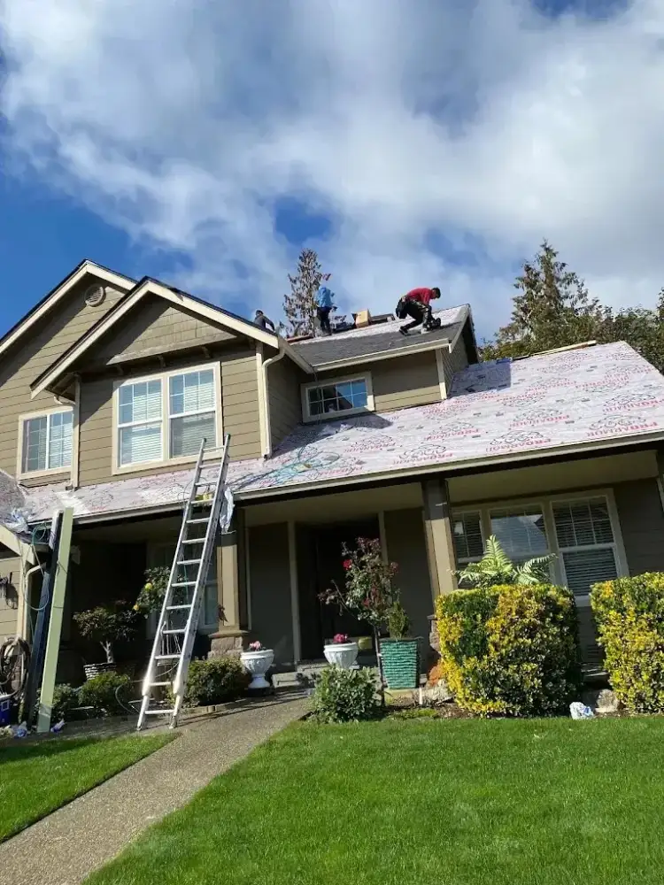 First Choice Roof Service crew mid-replacement on a Puget Sound area home